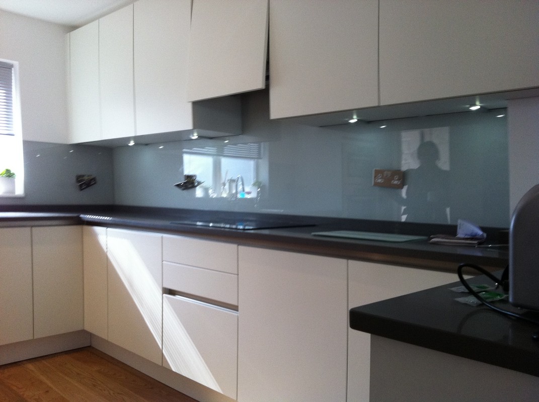 Grey glass kitchen splashback with LED lighting in Soho