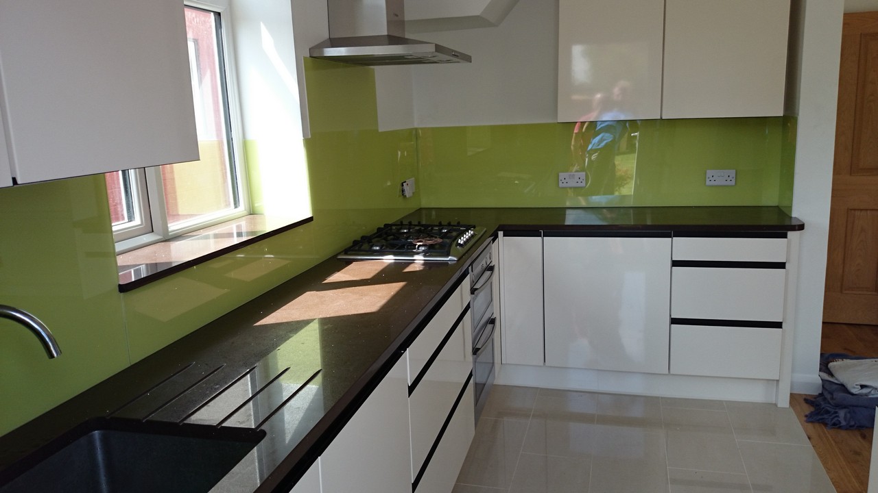 Lime green glass kitchen splashback installed by Soho glaziers